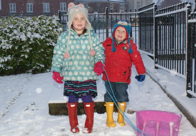 Youngsters sledging in the snow