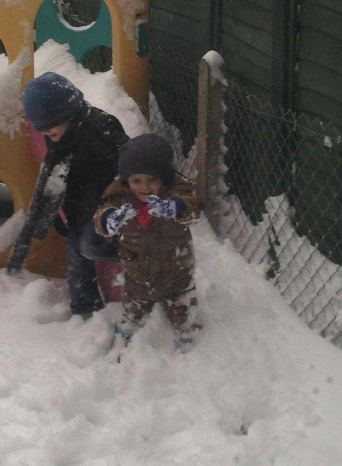 Two-year-old Aiden and six-year -old Rhys Stacey having fun in the snow aidens 1st taste of snow :) from park south swindon