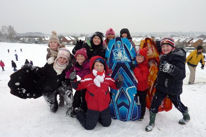 Children from Bridlewood School enjoying the snow on St Andrew's Ridge by Tim Keen