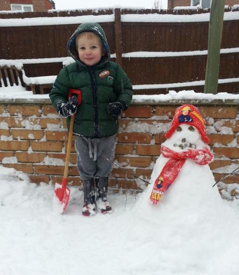 Sean Claridge and his first snowy man, by Carol Pinnegar