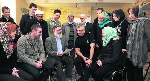 Wiltshire police at Habib Islamic Mosque and cultural centre. Shahid Khan third left, leads the discussions with Imam Zahid Mohd behind and to the left of Shahid and Abdul Latif and Syed Naqui back centre