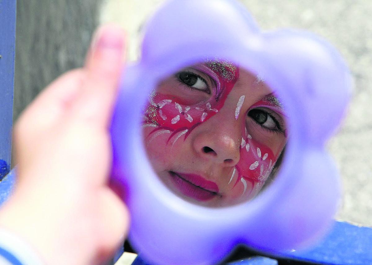 Admiring her eye-catching makeover at the Old Town market and music extravaganza is six-year-old Fraya Wilson.