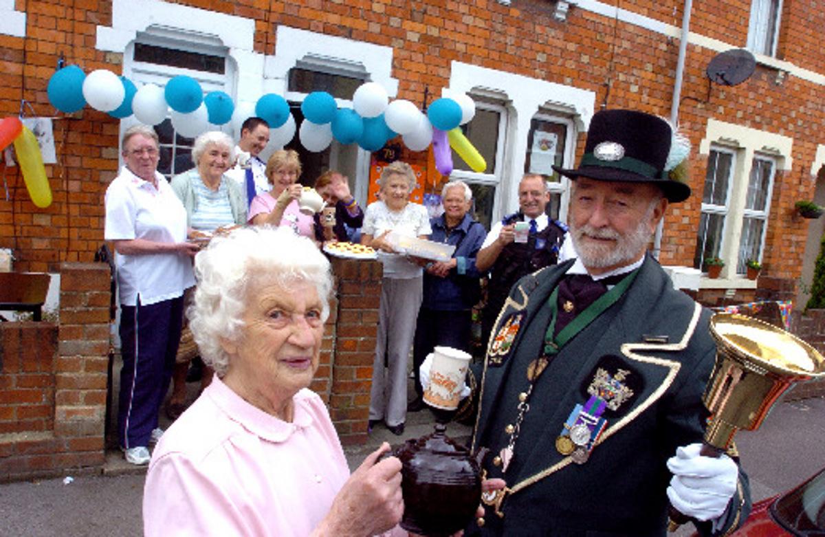 Fred 2007: Grace Walker (front left) holds a street tea party in aid of the Blue Cross. With Grace is town crier Fred Ferris. 