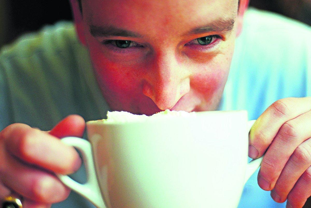 n Tom Rhys enjoys a hot chocolate in Royal Wootton Bassett                                                                                        Picture: THOMAS KELSEY