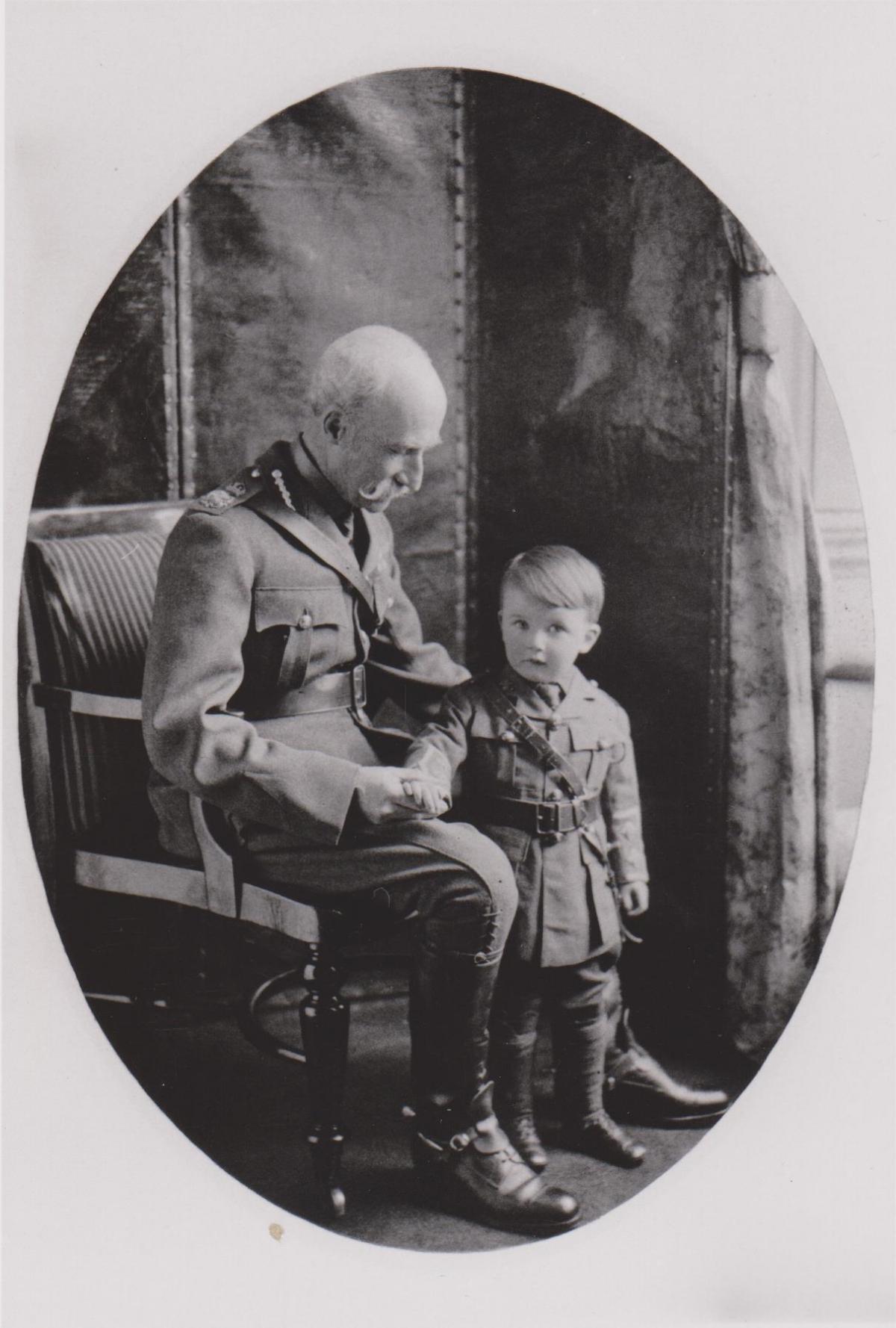 The 5th Marquess of Lansdowne, in military uniform, as he clasps the hand of the wide-eyed grandson George, dressed up as a little soldier boy. The Bowood Estate has been in the Lansdowne family for more than 250 years.