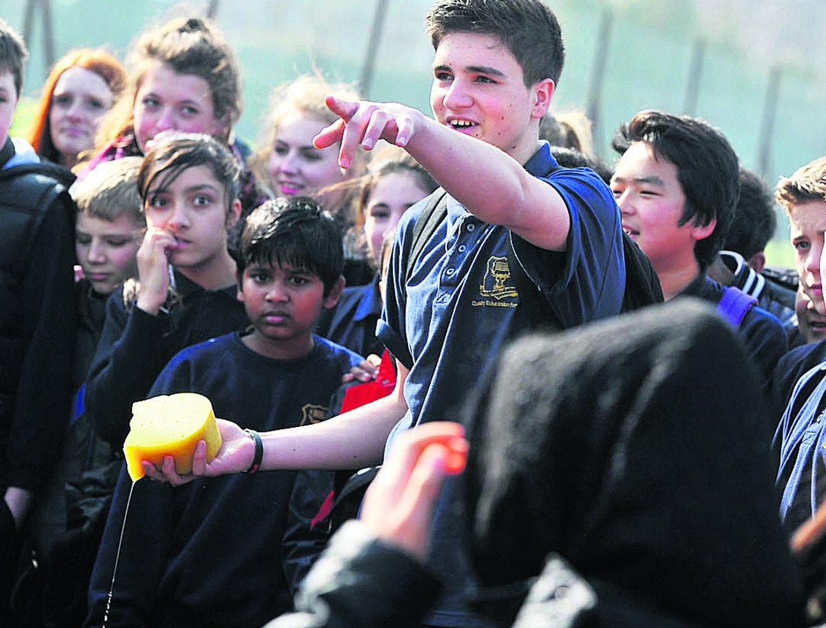n Churchfields Academy pupil Roberto picks his target during the charity Sport Relief event yesterday where children got to soak their teachers with sponges       Picture: DAVE COX