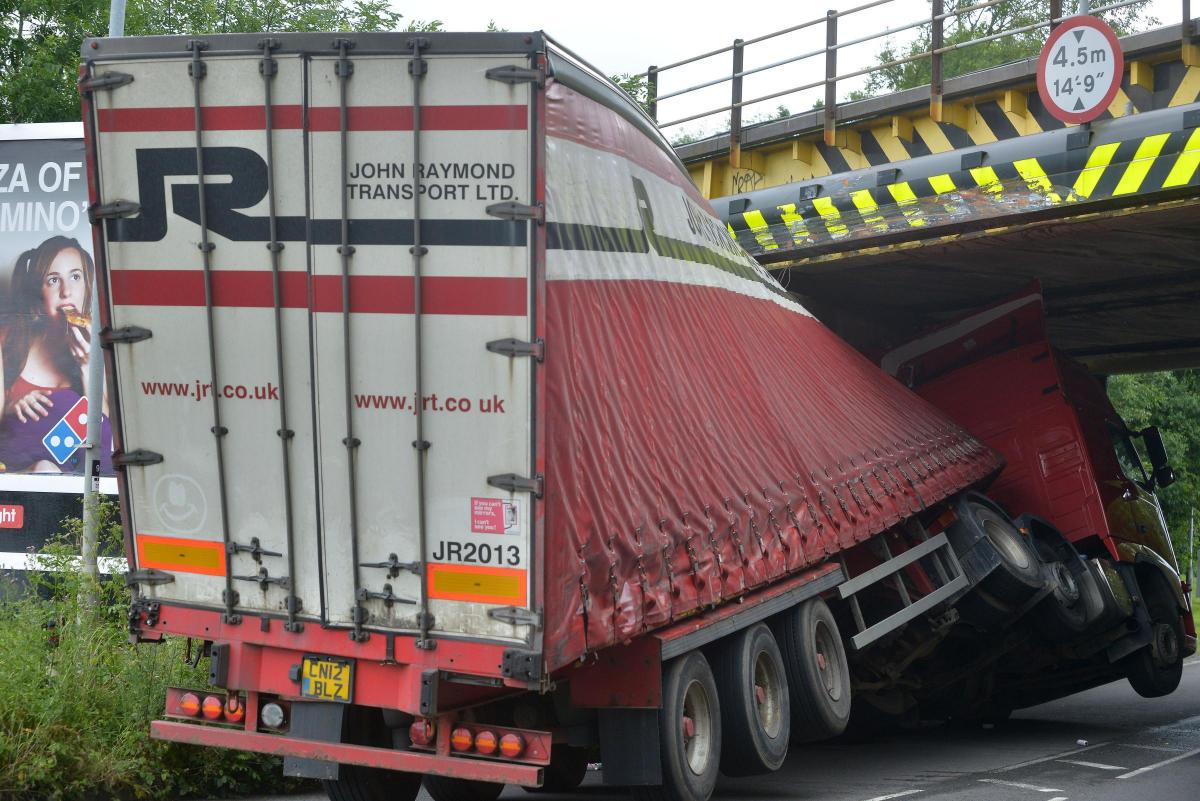 A Lynx deodorant lorry stuck under Wootton Bassett Road bridge on June 27, 2014. Picture: THOMAS KELSEY