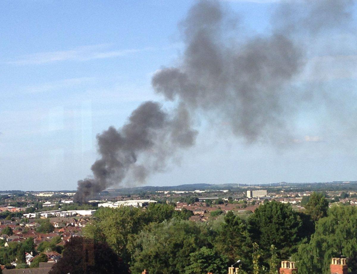 A plume of black smoke billows across the Swindon skyline yesterday evening