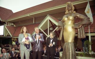 Diana's son Jason stands with filmmaker David Puttnam at the grand unveiling of his mother's statue in 1991.