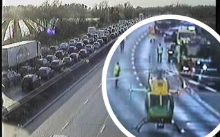 An air ambulance landed on the M4, while traffic queued for two miles.