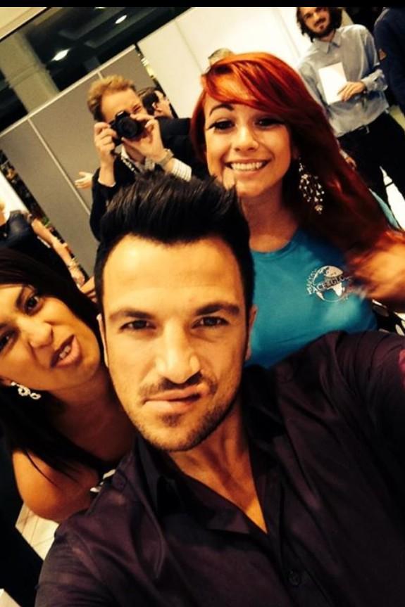 Competition winners Georgia Delaney, left, and Hannah Golding, right, pose for a selfie with Peter Andre.