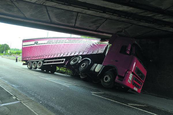 The Lynx deodorant lorry stuck under Wootton Bassett Road bridge on June 27, 2014. Picture: THOMAS KELSEY