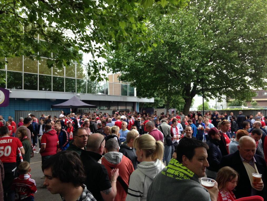 Mike Benke: Nothing says Wembley like a £5 pint in a plastic pot. Here's the Red Army enjoying just that.