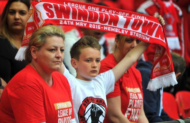 Swindon fans do their best to stay cheerful