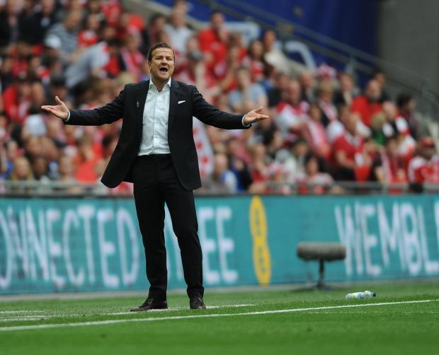 Town boss Mark Cooper looks non-plussed by his side's performance