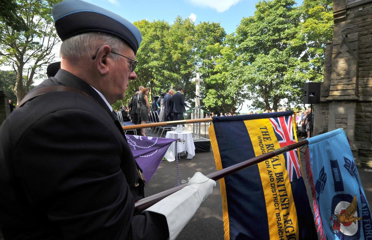 Standards are lowered at Radnor Street Cemetery on Battle of Britain Day. Picture by Dave Cox