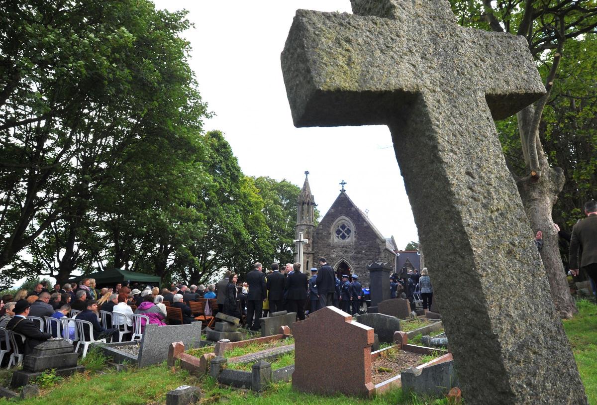 Those gathered to pay their respects in Radnor Street Cemetery on Battle of Britain Day. Picture by Dave Cox