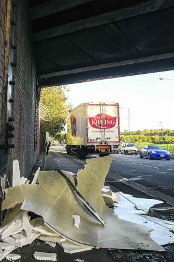 The roof of a Mr Kipling lorry was torn off when it hit the bridge on October 30, 2013