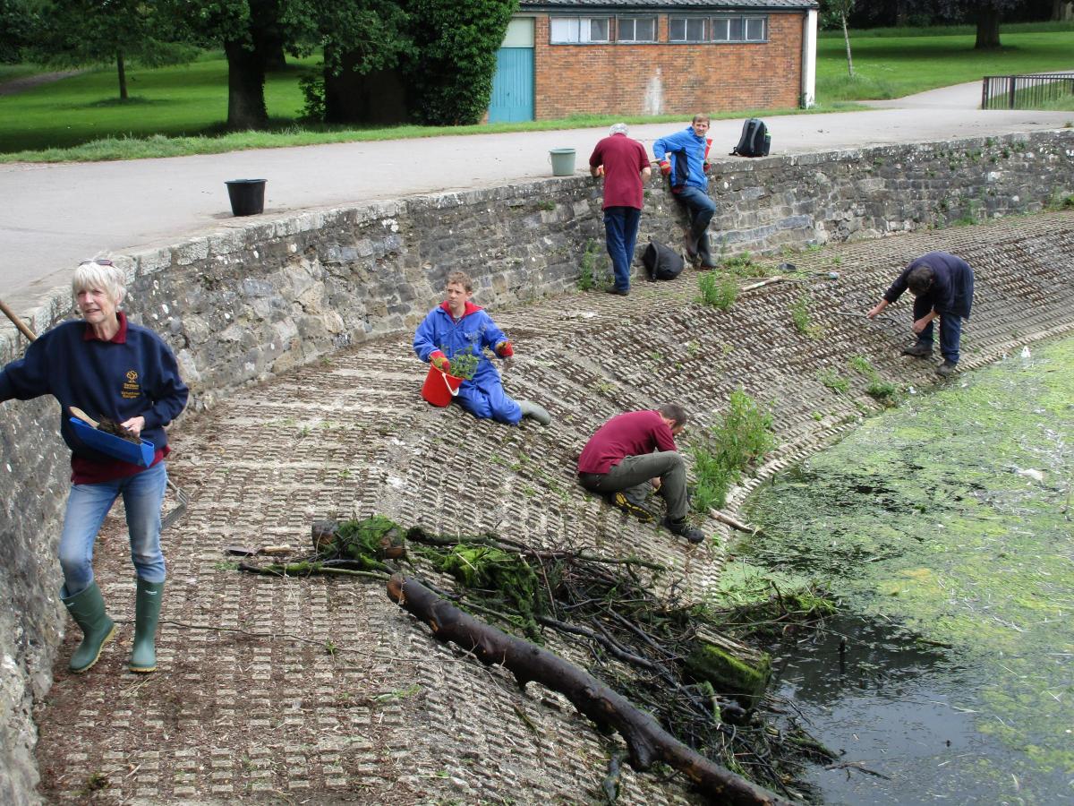 Volunteers getting Coate Water ready for the dragon boat race in the summer                                      Picture: ROY CARTWRIGHT