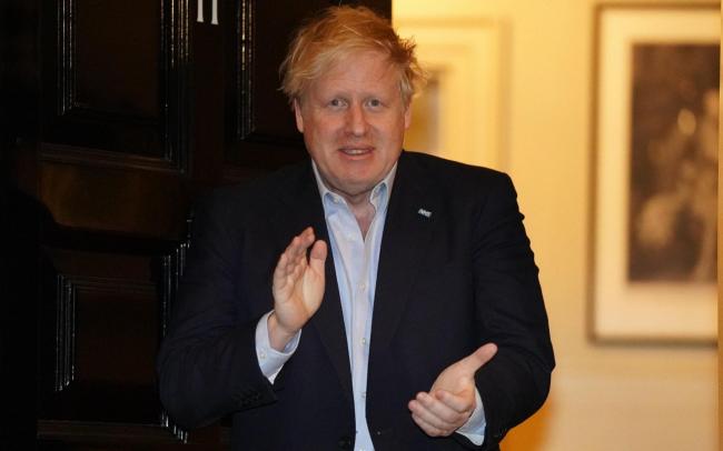 Boris Johnson claps for the NHS