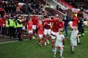 STFC v Forest Green       Pic Dave Evans      7/3/20
Eoin Doyle accompanies mascots on the field