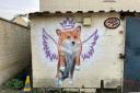 Flying corgi mural painted in Malmesbury as tribute to the Queen