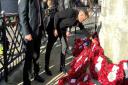 Paying his respects: Mitchell Bryan lays the poppy wreath down at the cenotaph on Sunday.
