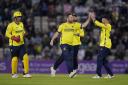 Hampshire Hawks' Liam Dawson (centre) celebrates taking the wicket of Surrey's Tom Curran during the T20 Blast match at The Ageas Bowl, Southampton.