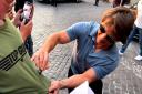 Tom Cruise delighted a 5-year-old boy from Wiltshire after signing his top outside a hotel in Rome.