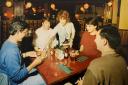 A group of friends enjoy having a meal at Pinkerton’s in June 1991