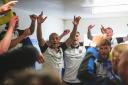 Radcliffe celebrate in the changing room after winning the league title Picture: Barkley Costello