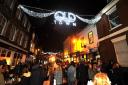 Crowds turn out to enjoy the spectacle in Wood Street for the Old Town Christmas lights switch-on. Picture by Dave Cox