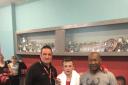 Young Walcot ABC fighter John Delaney with his coaches after his win in Trowbridge