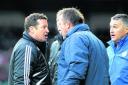 Town boss Danny Wilson has a heated exchange with the Sheffield Wednesday coaching staff on Saturday