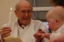 Derryck Evans baptising his grandson in April this year