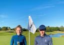 Calum and Maya Fitzgerald holding their respective winner’s trophies at the Bowood Golf Club Championships