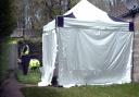 A tent erected outside a house in Fosse Way by police