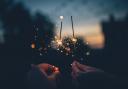 Two people holding sparklers for Bonfire night. Credit: Canva
