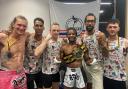 Members of Doctores Muay Thai gym in Swindon celebrate Aion McRae's British Featherweight Title victory