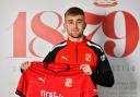 Swindon Town’s new signing Jake Cain poses for the camera after penning a two-and-a-half-year contract   Pic: Callum Knowles