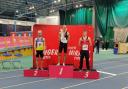 Matt Woodward (centre) on the of the podium at the Welsh Indoor Championships after winning the 1500m Pic: Swindon Harriers