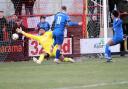 Chippenham Town forward Alex Bray slams the ball into the net against Welling United on Saturday Photo: Richard Chappell