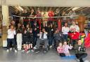 Volunteer coaches and clients at Scrappers Gym before it closed in May