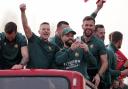 Wrexham’s Paul Mullin (left), Wrexham’s Elliot Lee (centre) and Wrexham’s Ben Foster seen on the open top bus during a victory parade in Wrexham