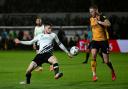 Derby County's Max Bird (left) and Newport County's Cameron Norman in action during the FA Cup second-round match at Rodney Parade last season