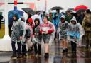 People in the rain at RIAT 2023