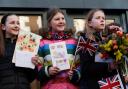 School children from Swindon presented the Queen with 'get well soon' cards for Charles.
