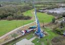 A new trip boat being craned into a canal near Swindon