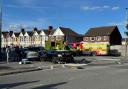 Emergency service vehicles filled County Road after two cars and a bus collided on a mini-roundabout