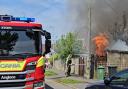 Firefighters kicked down a fence to tackle a blaze on Drove Road